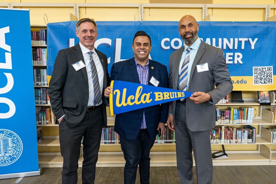 From left: Sean Teer, principal of Downtown Magnets High School; California Assemblymember Mark Gonzalez; and UCLA Interim Chancellor Darnell Hunt in the Downtown Magnets library.